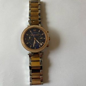 Michael Kors two-toned watch. Blue face with Diamond bezel.